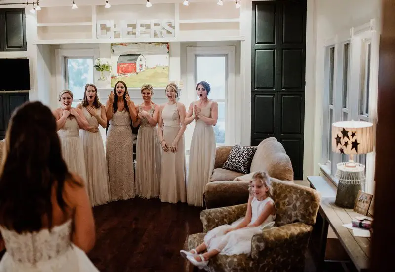 Bride revealing her wedding dress at the Aurora Cellars event in Lake Leelanau, MI.