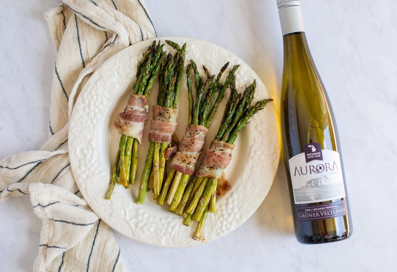 Bacon wrapped asparagus paired with Aurora Cellars wine
